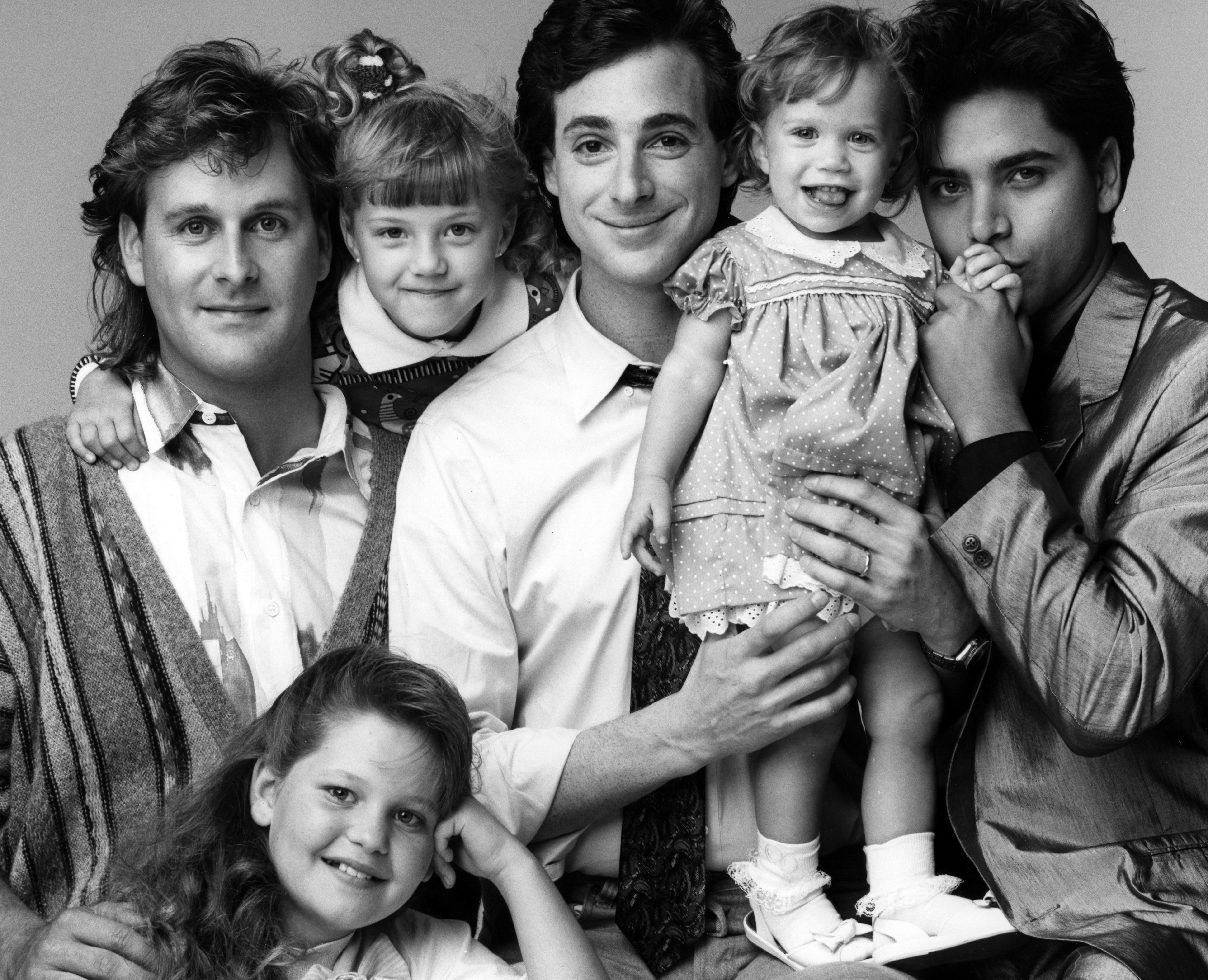 Dave Coulier, Candace Cameron Bure (below), Jodie Sweetin, Bob Saget, Mary-Kate/Ashley Olsen, John Stamos for "Full House" on May 9, 1988 | Source: Getty Images
