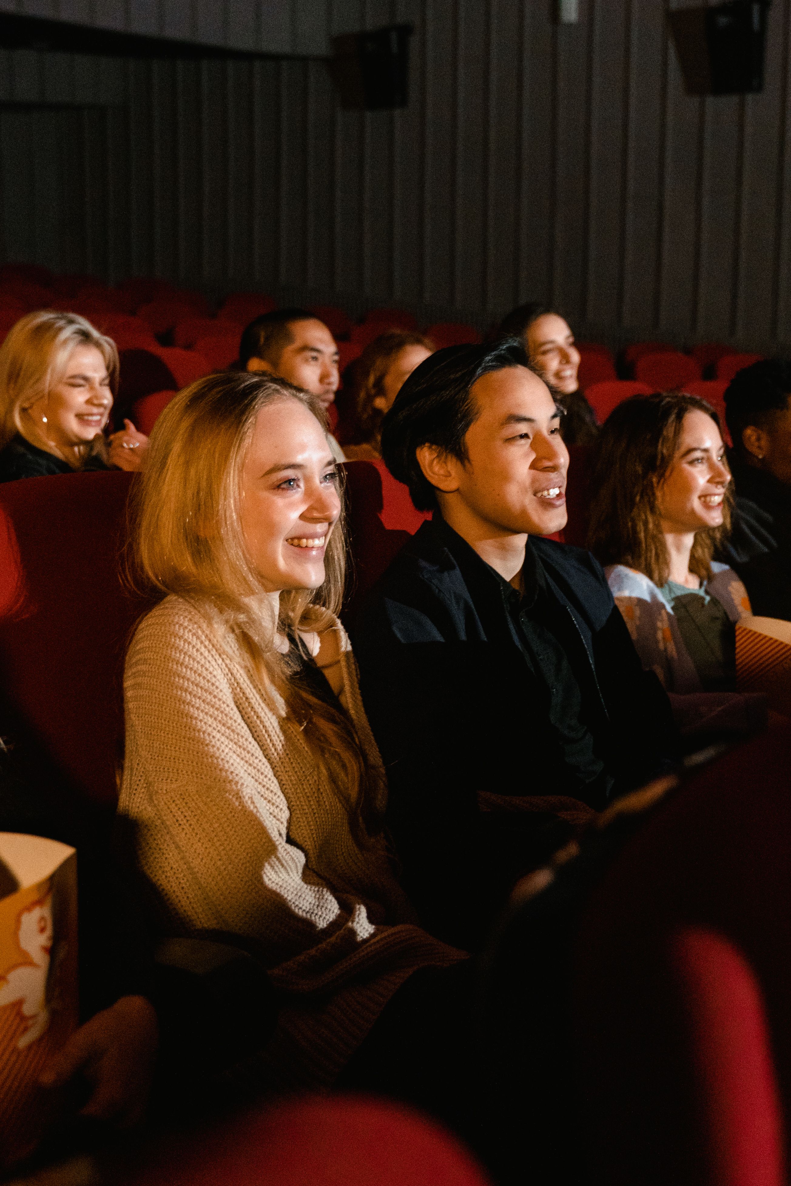 Young moviegoers enjoying a movie in the theater | Source: Pexels