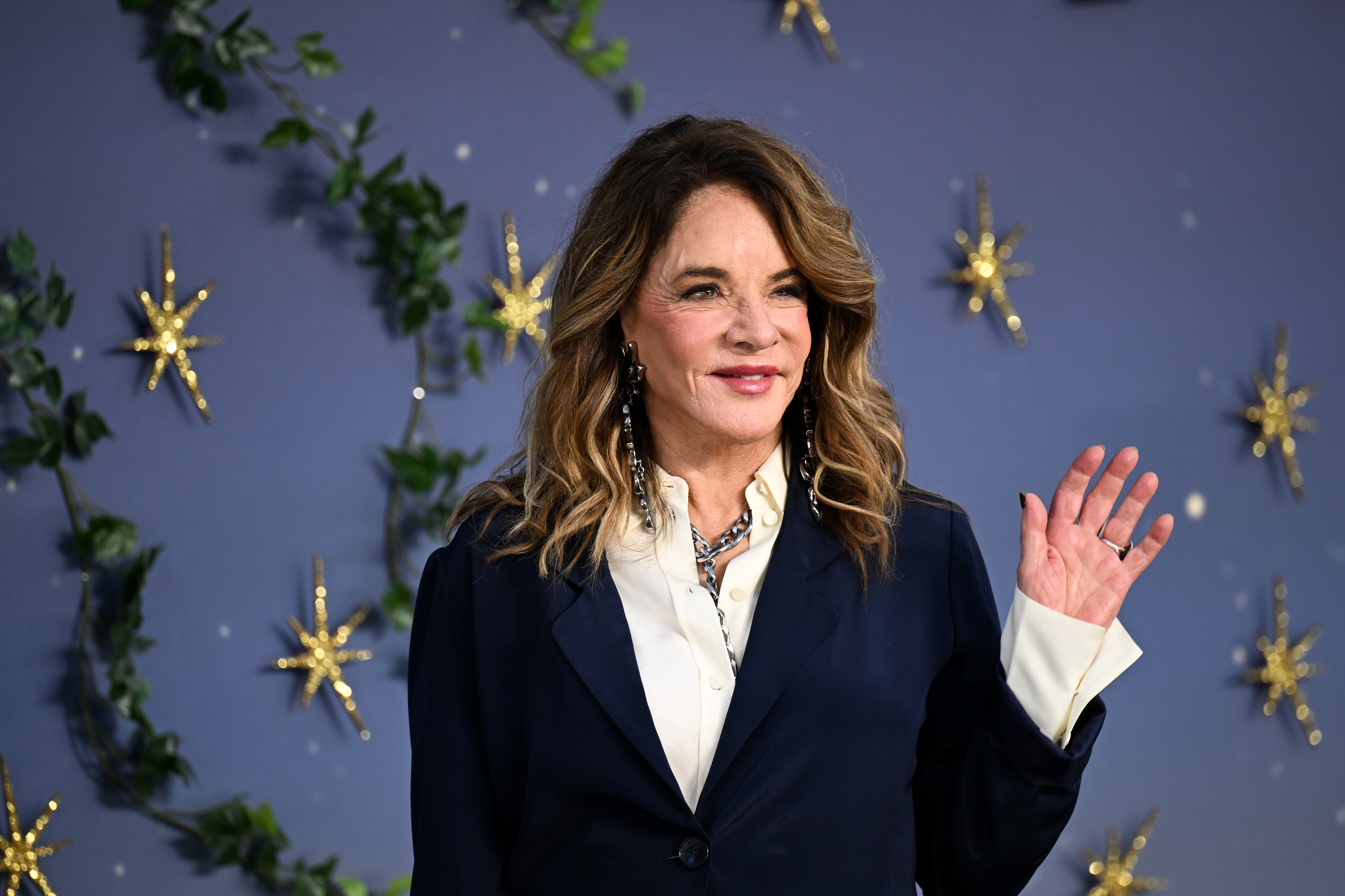 Stockard Channing waves for the audience at the European premiere of "Practical Magic 2" in London, England, on August 26, 2026 | Source: Getty Images