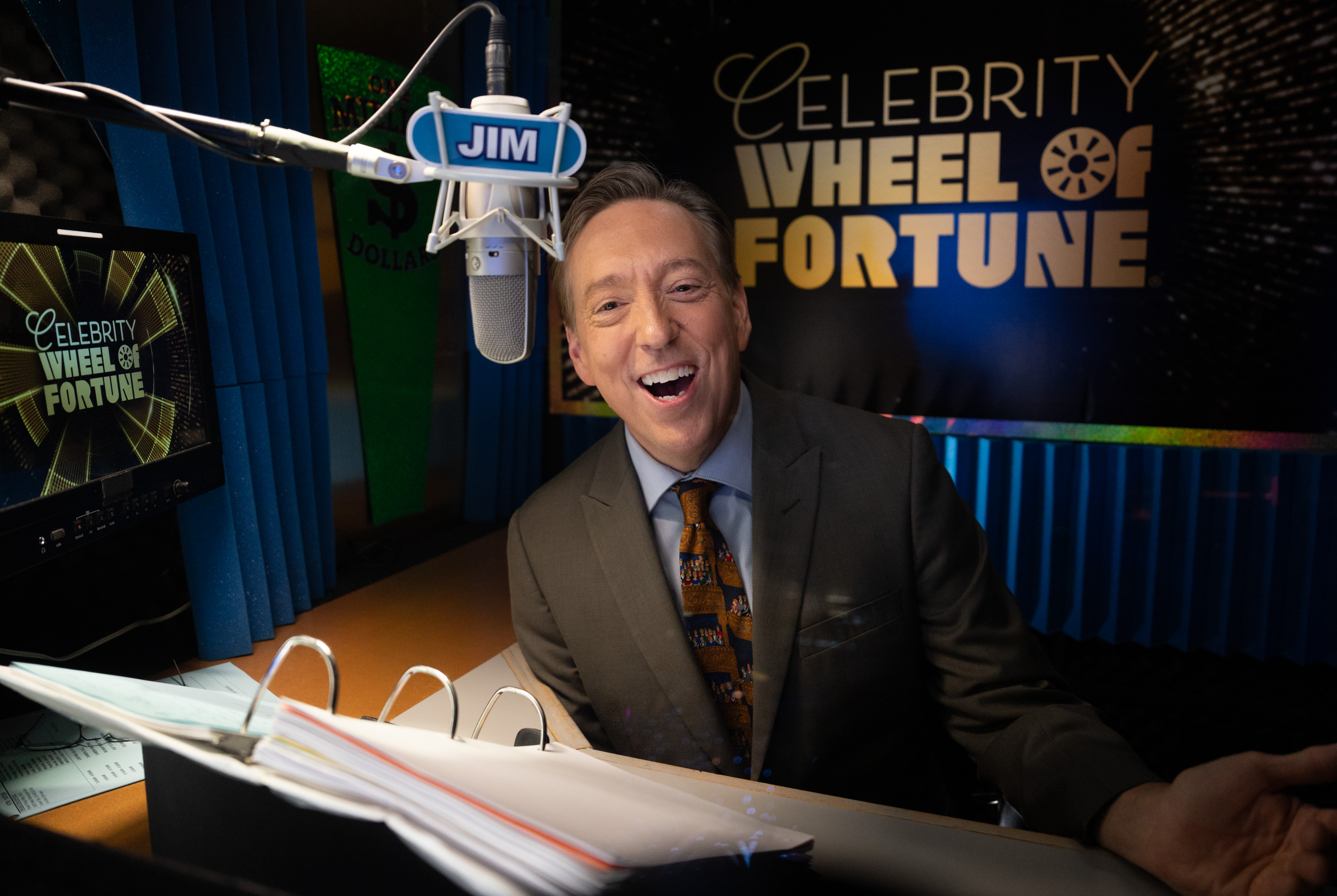 Announcer Jim Thornton behind the microphone for "Celebrity Wheel of Fortune," dated October 7, 2024 | Source: Getty Images